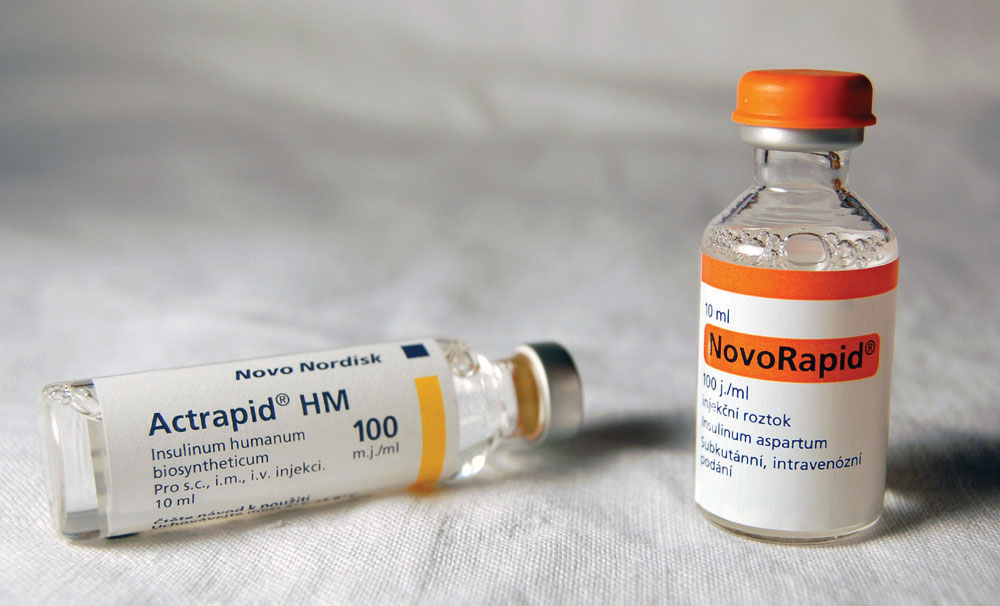 Two glass bottles of liquid medicines: Actrapid HM and NovoRapid